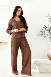 plačios moteriškos kelnės